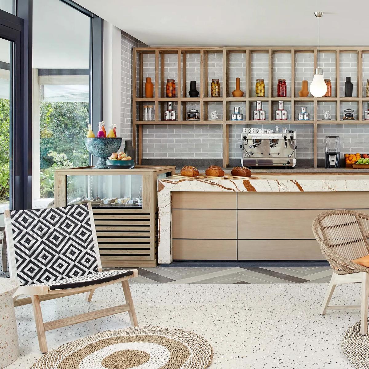 Waves Café's counter, with an espresso bar, pastries and fresh fruit
