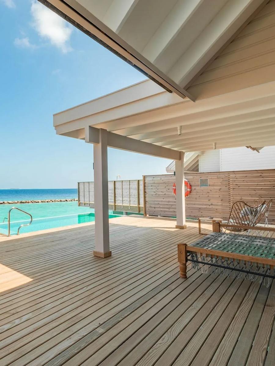 A Water Pool Villa's deck and private pool, raised over the lagoon