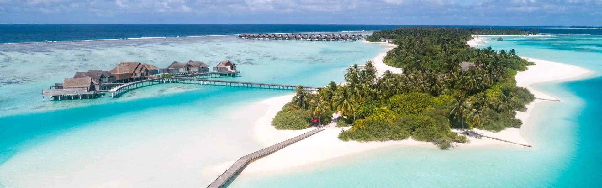 Aerial view of Niyama's Chill and Play islands, linked by an overwater boardwalk across Dhaalu Atoll's lagoon