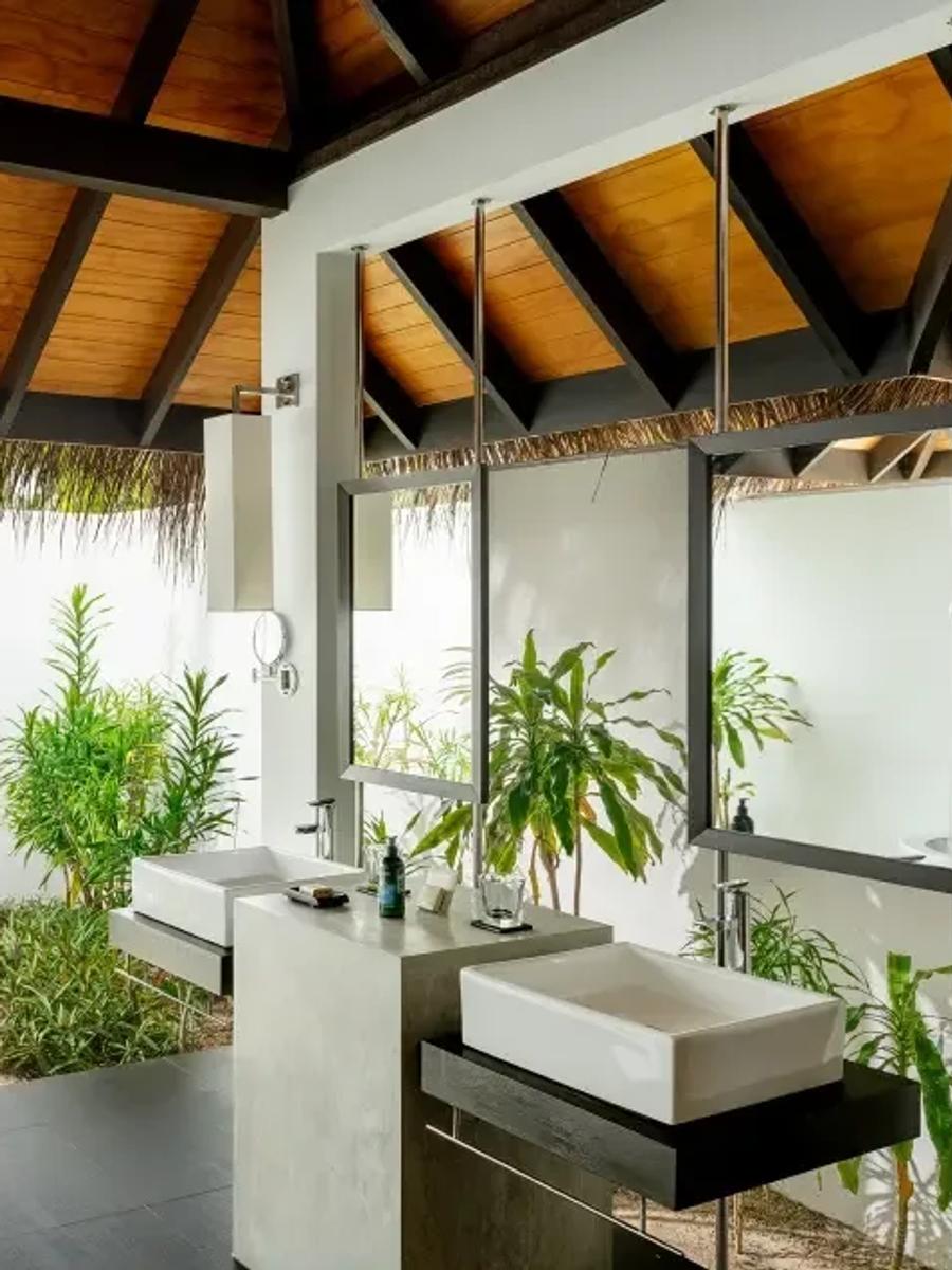 Beach Villa with Pool's open-air garden shower, screened by tropical planting