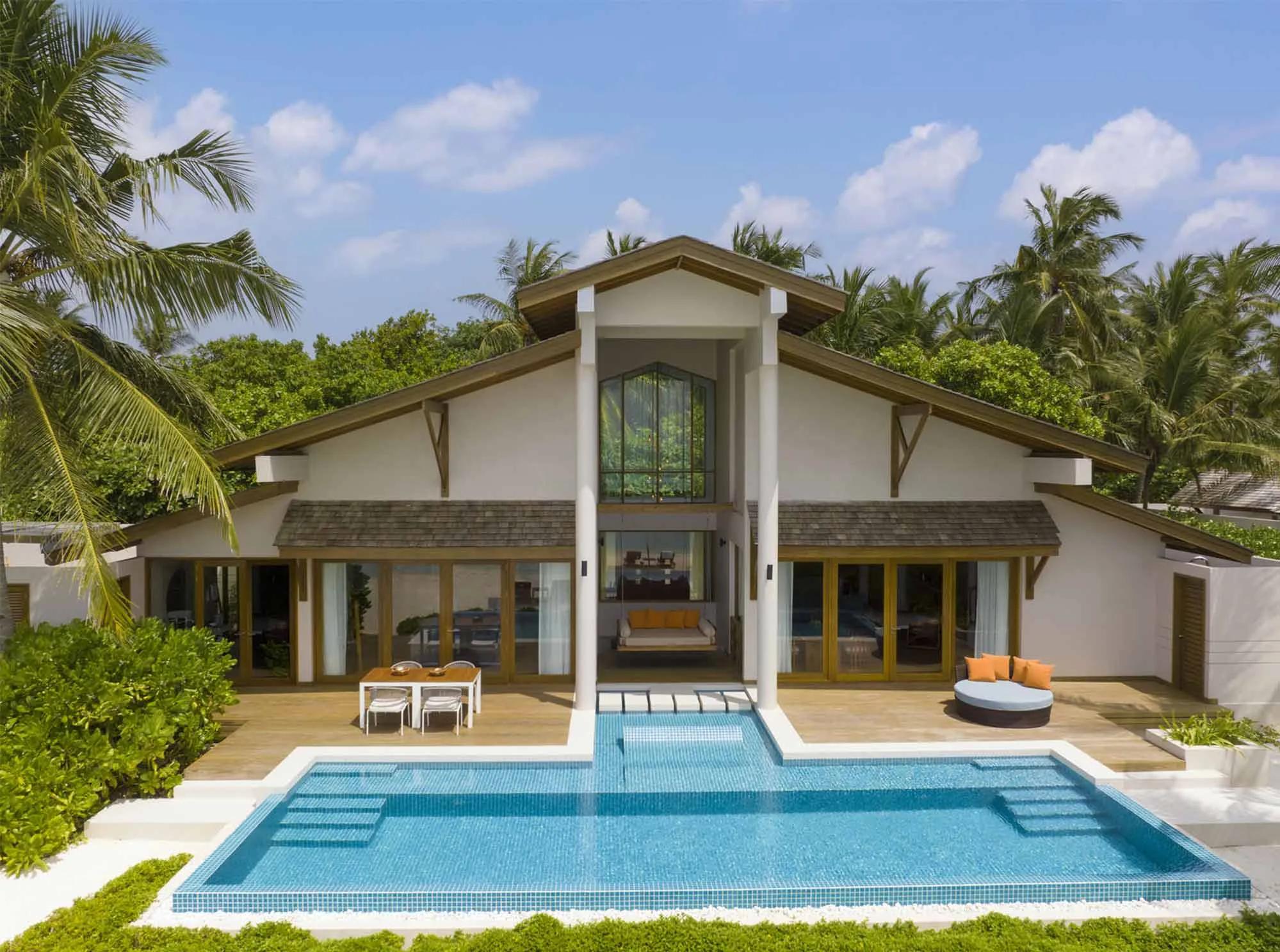 The Two Bedroom Presidential Beach Villa's interior, opening onto its private pool terrace
