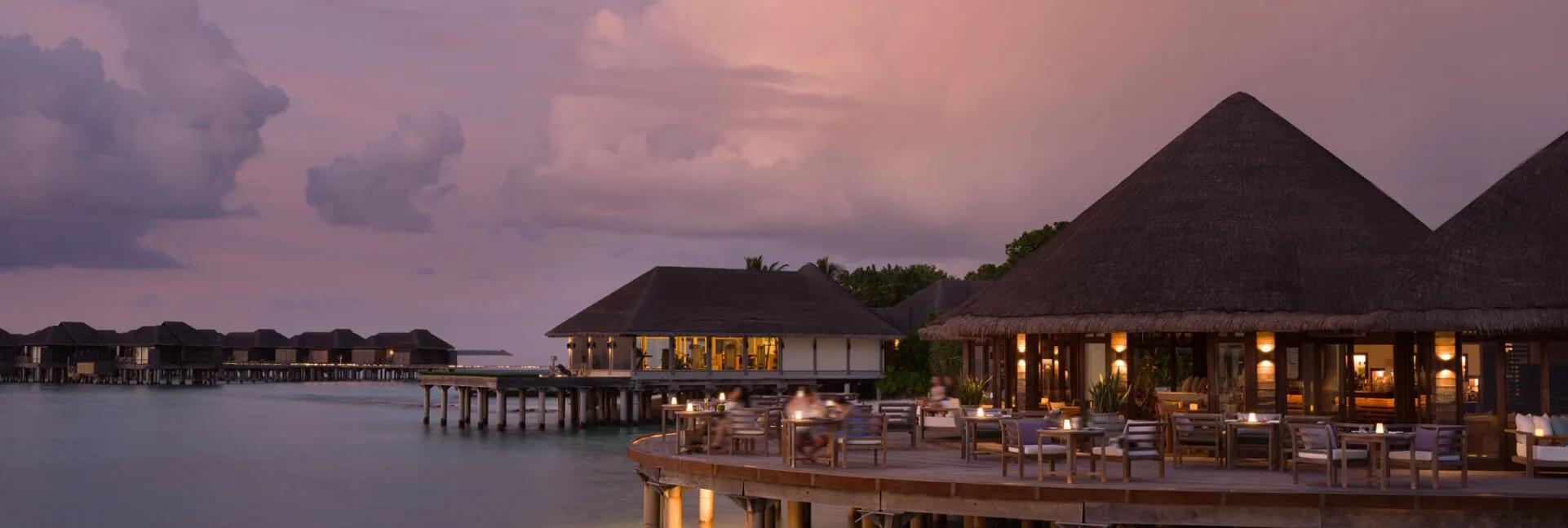 White Orchid's overwater terrace at JA Manafaru, set for a Japanese-inspired teppanyaki dinner