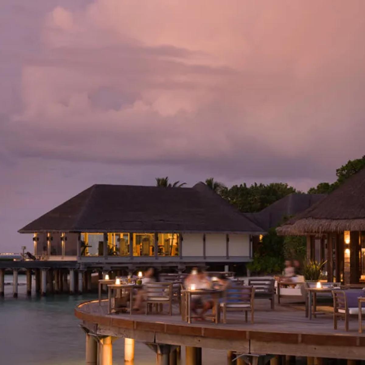 White Orchid's overwater terrace at JA Manafaru, set for a Japanese-inspired teppanyaki dinner
