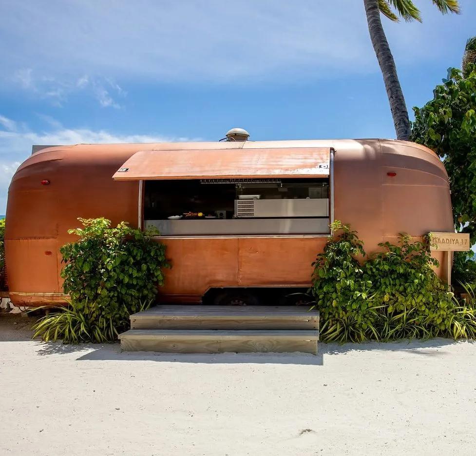 Gaadiya 17, a restored vintage Airstream trailer serving as OBLU SELECT Lobigili's beachfront grill restaurant
