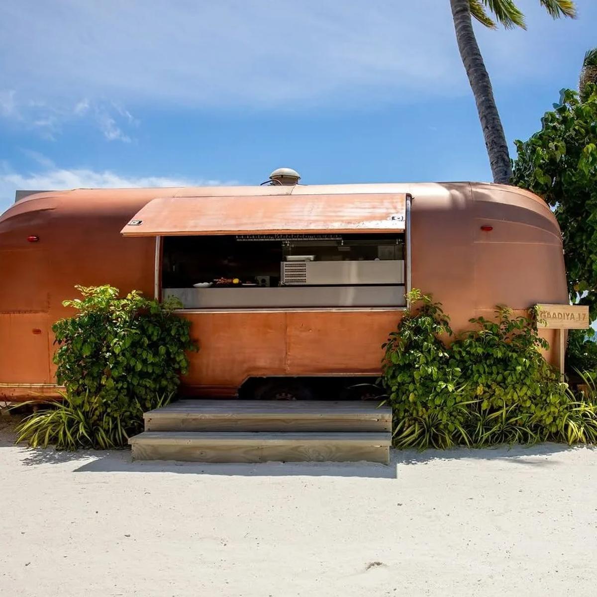 Gaadiya 17, a restored vintage Airstream trailer serving as OBLU SELECT Lobigili's beachfront grill restaurant
