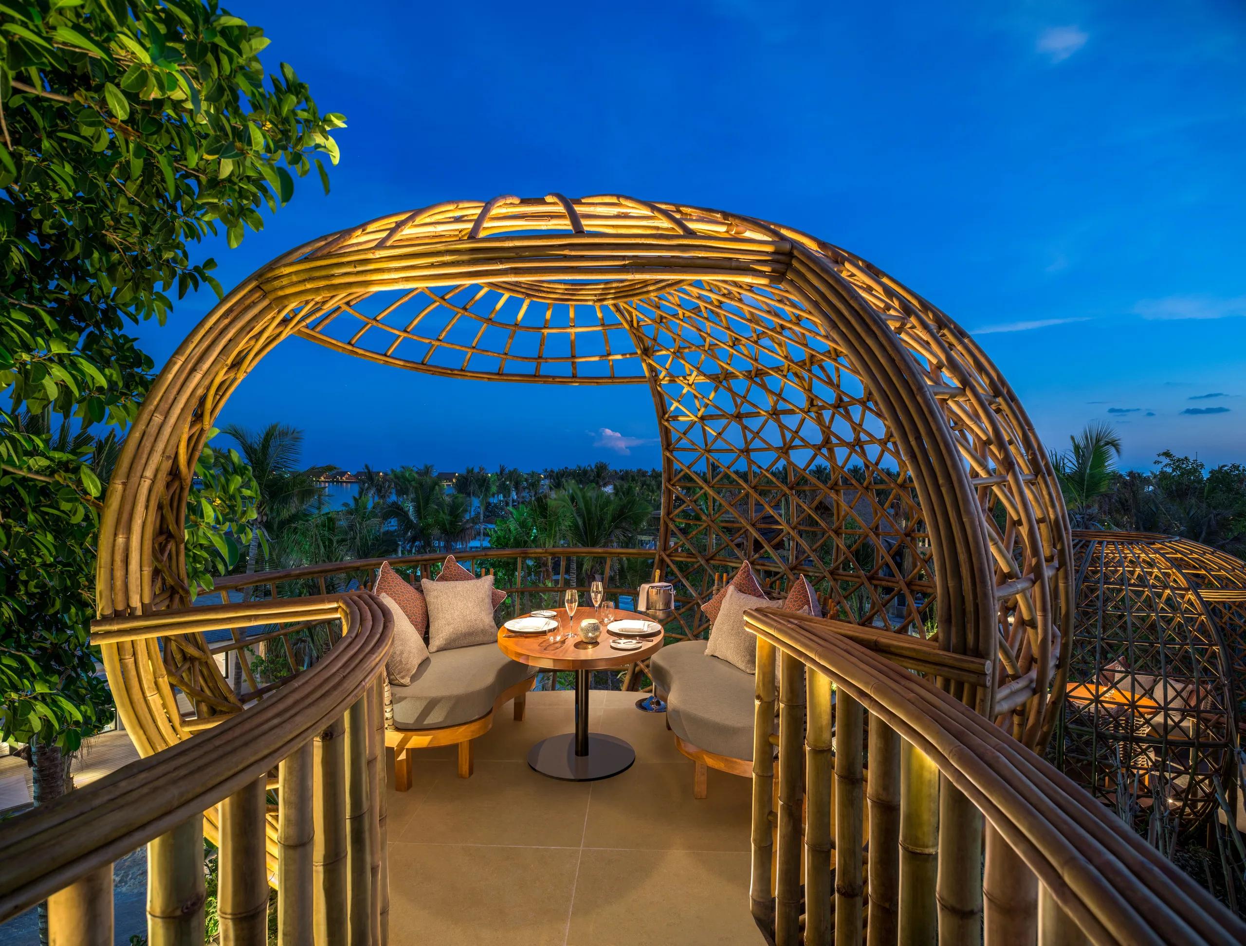 One of Terra's bamboo dining pods set into the island canopy at Waldorf Astoria Maldives Ithaafushi