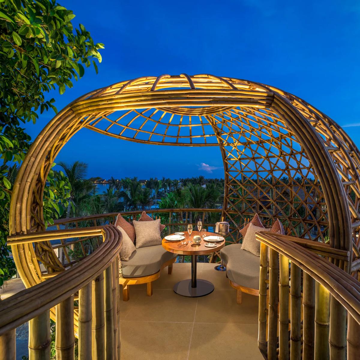 One of Terra's bamboo dining pods set into the island canopy at Waldorf Astoria Maldives Ithaafushi