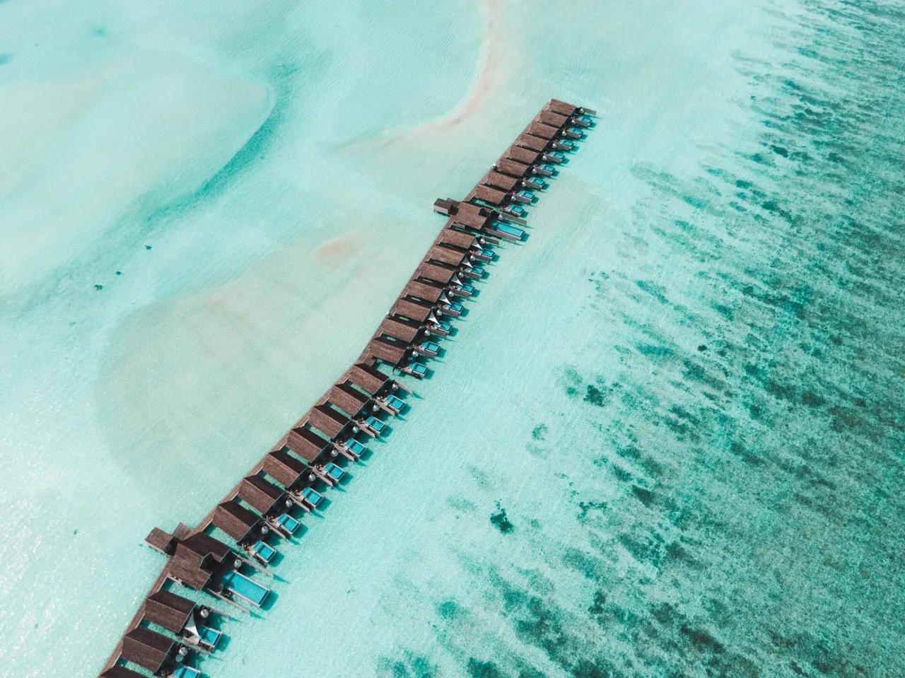 The overwater villa jetty at LUX* South Ari Atoll seen from directly above