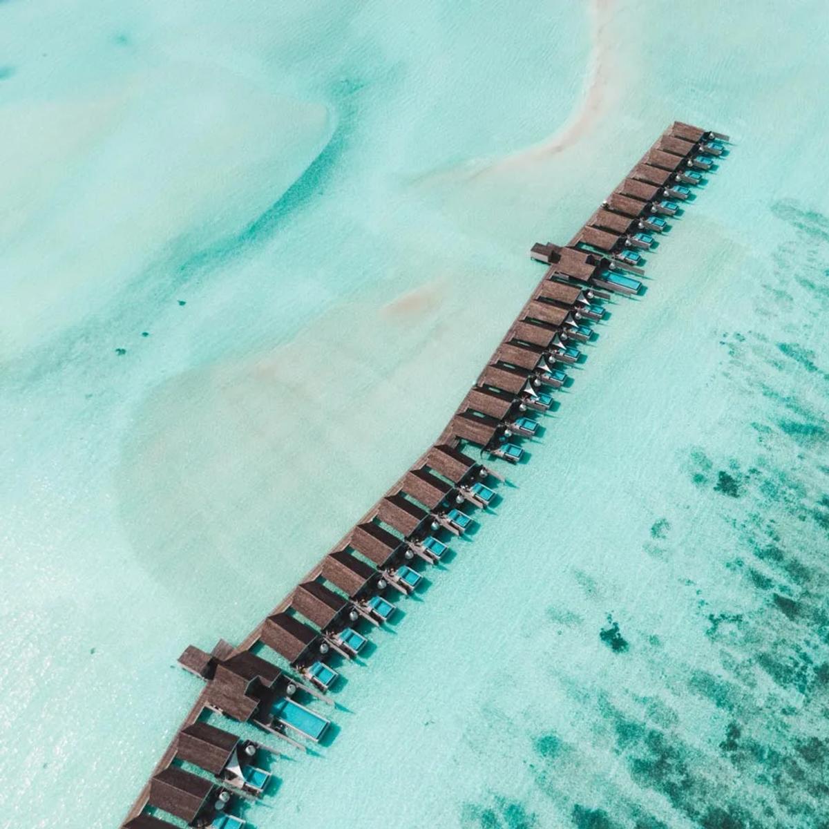 The overwater villa jetty at LUX* South Ari Atoll seen from directly above