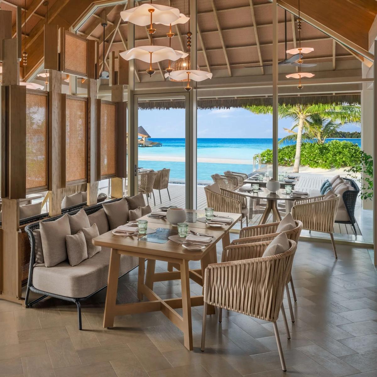Riva's oceanfront dining room, seating arranged toward the water