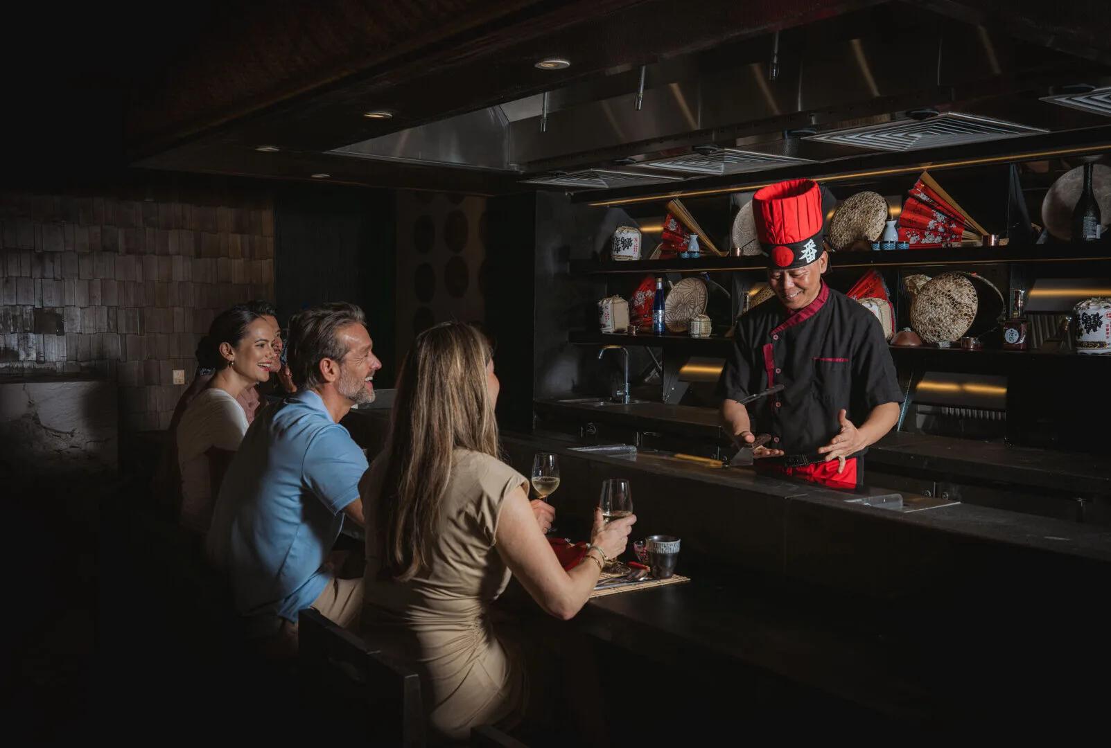 A chef performing live teppanyaki cooking for guests at the counter — stands in for Café Umi's own photography, not yet available
