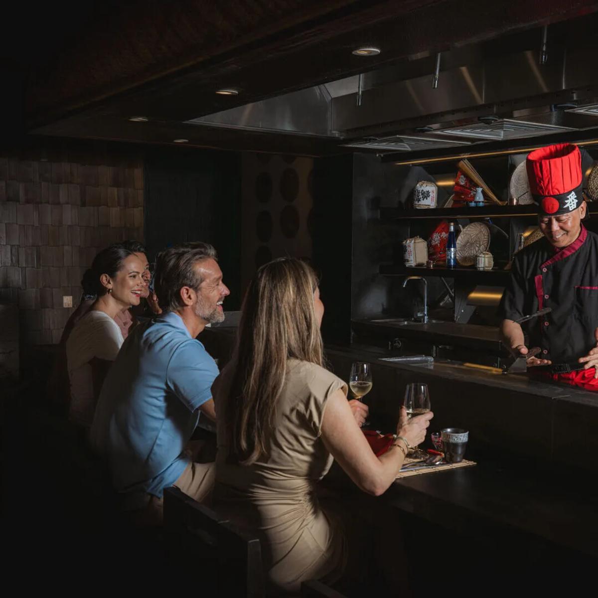 A chef performing live teppanyaki cooking for guests at the counter — stands in for Café Umi's own photography, not yet available