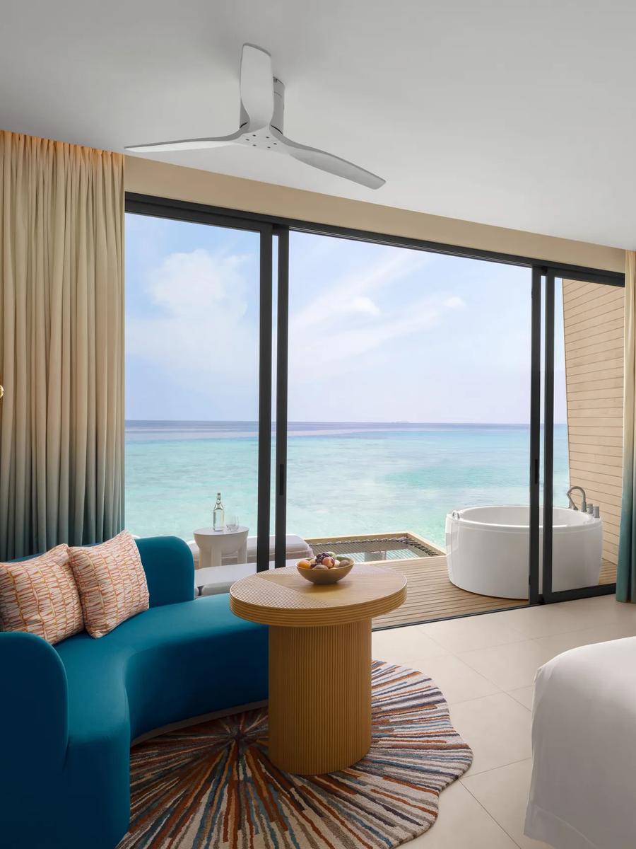An Overwater Villa with Jacuzzi, deck and lagoon view