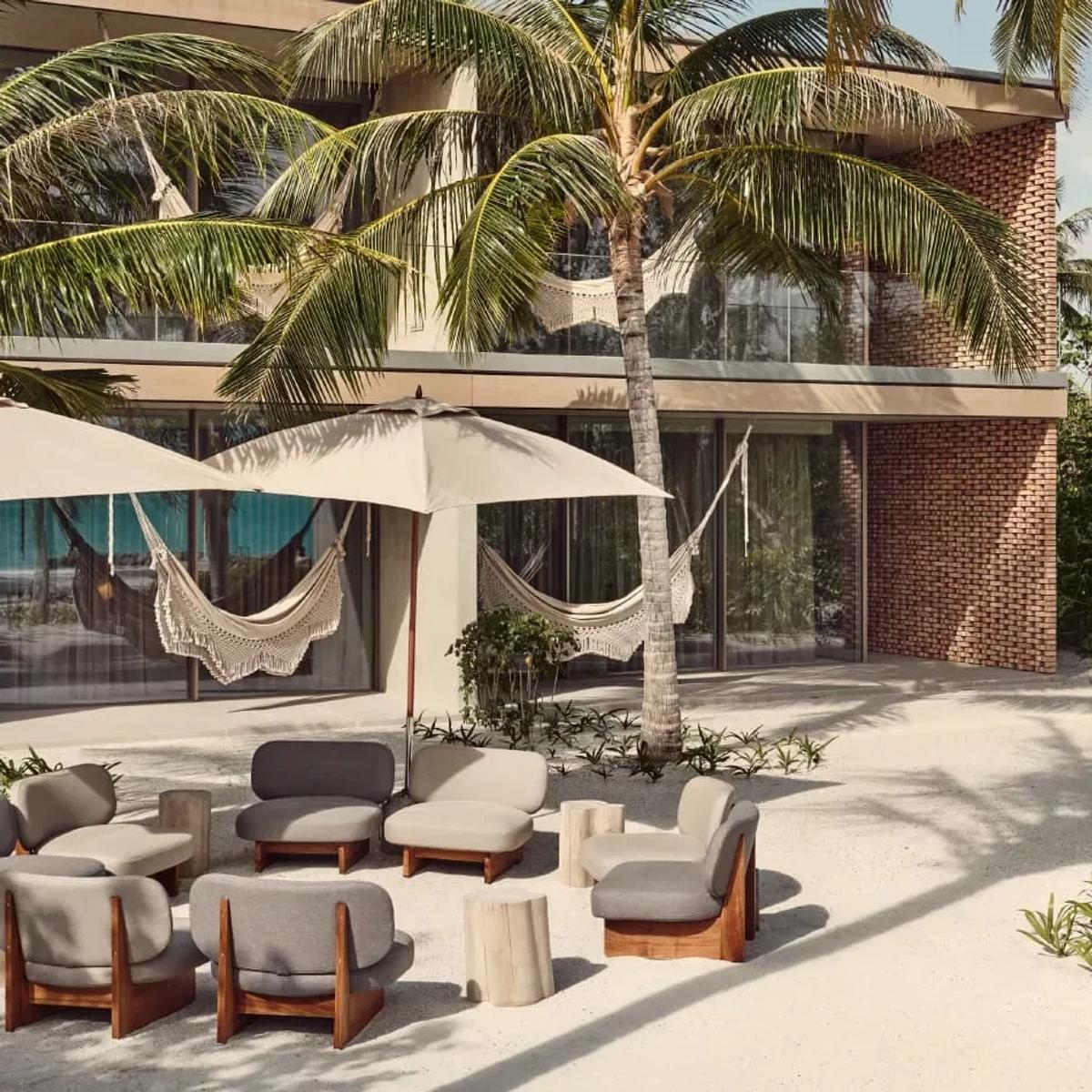 A guest terrace among the palms at Patina Maldives; a dedicated photograph of Kōen, the resort's Japanese-Scandinavian restaurant, to follow
