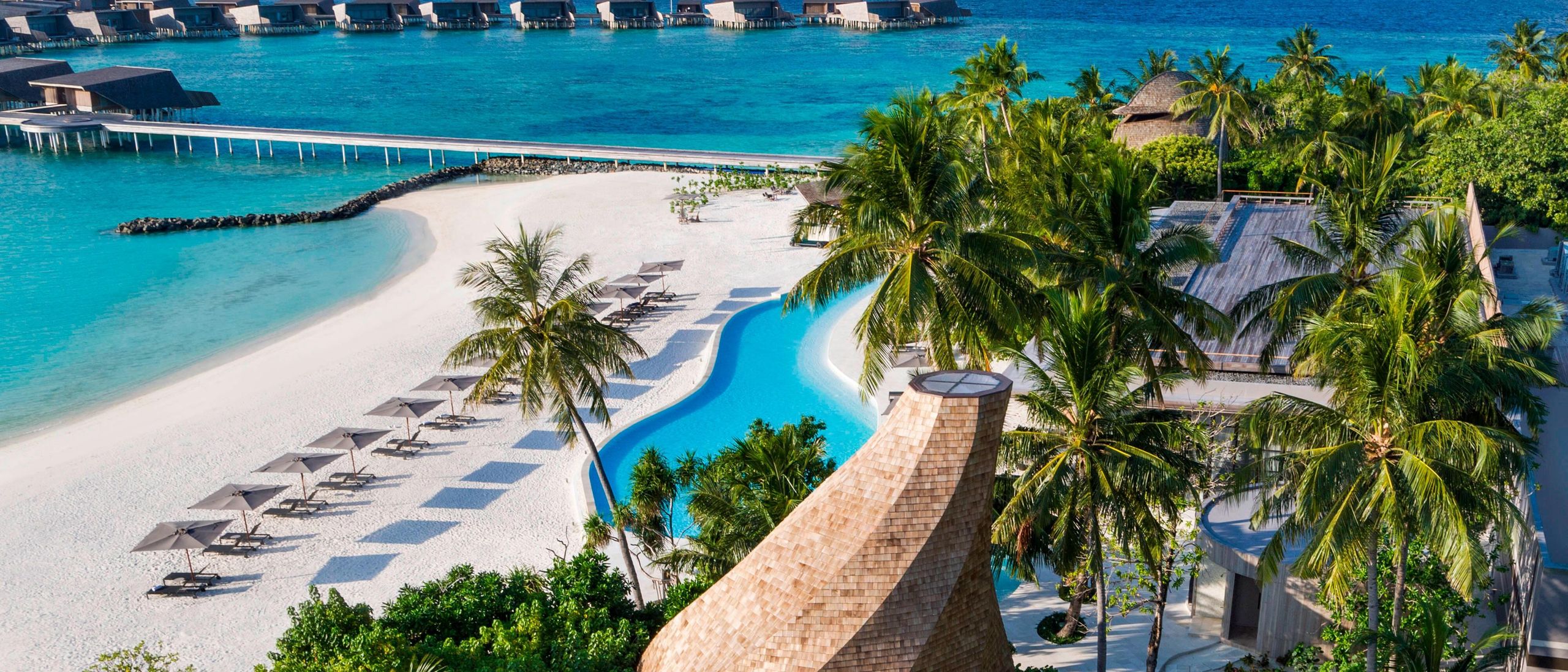 Aerial view of multiple Maldives luxury resort islands across atoll