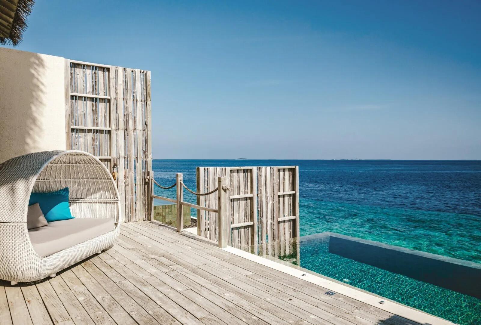 The private plunge pool and deck of a Lagoon Pool Villa, looking out over open water