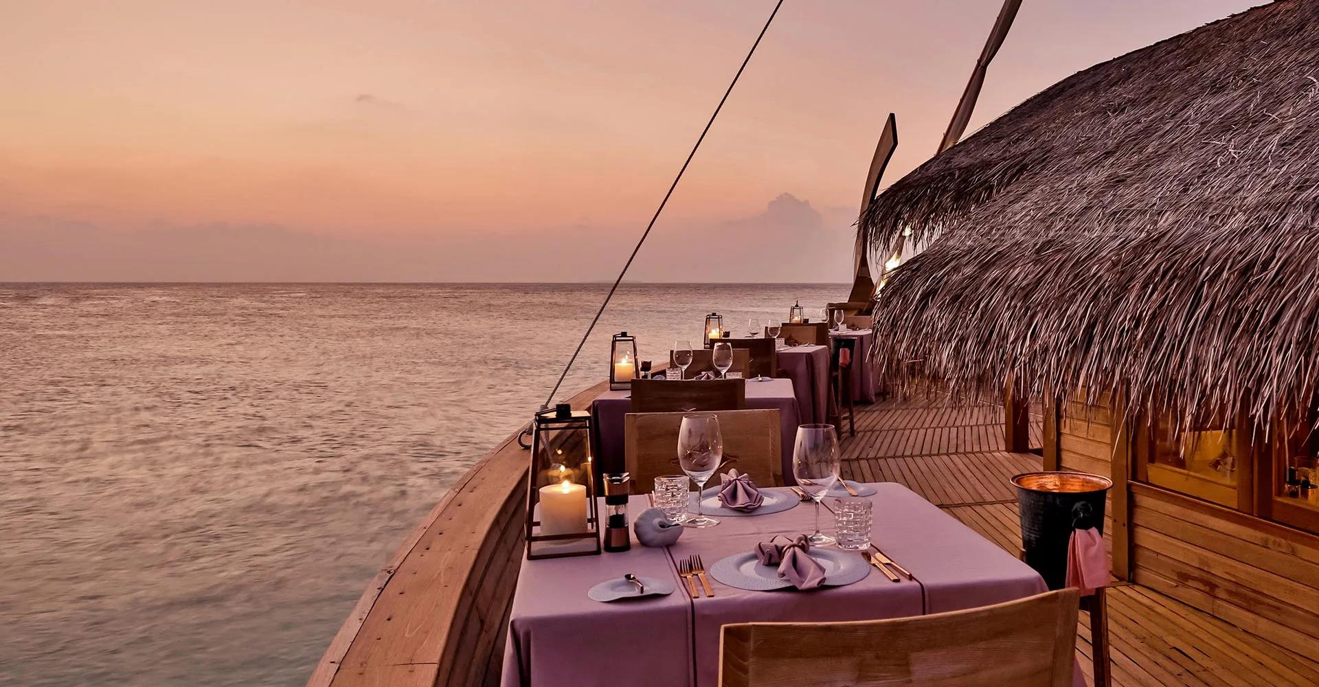 Ba'theli by the Reef, Milaidhoo's overwater restaurant built to resemble three traditional cargo boats.