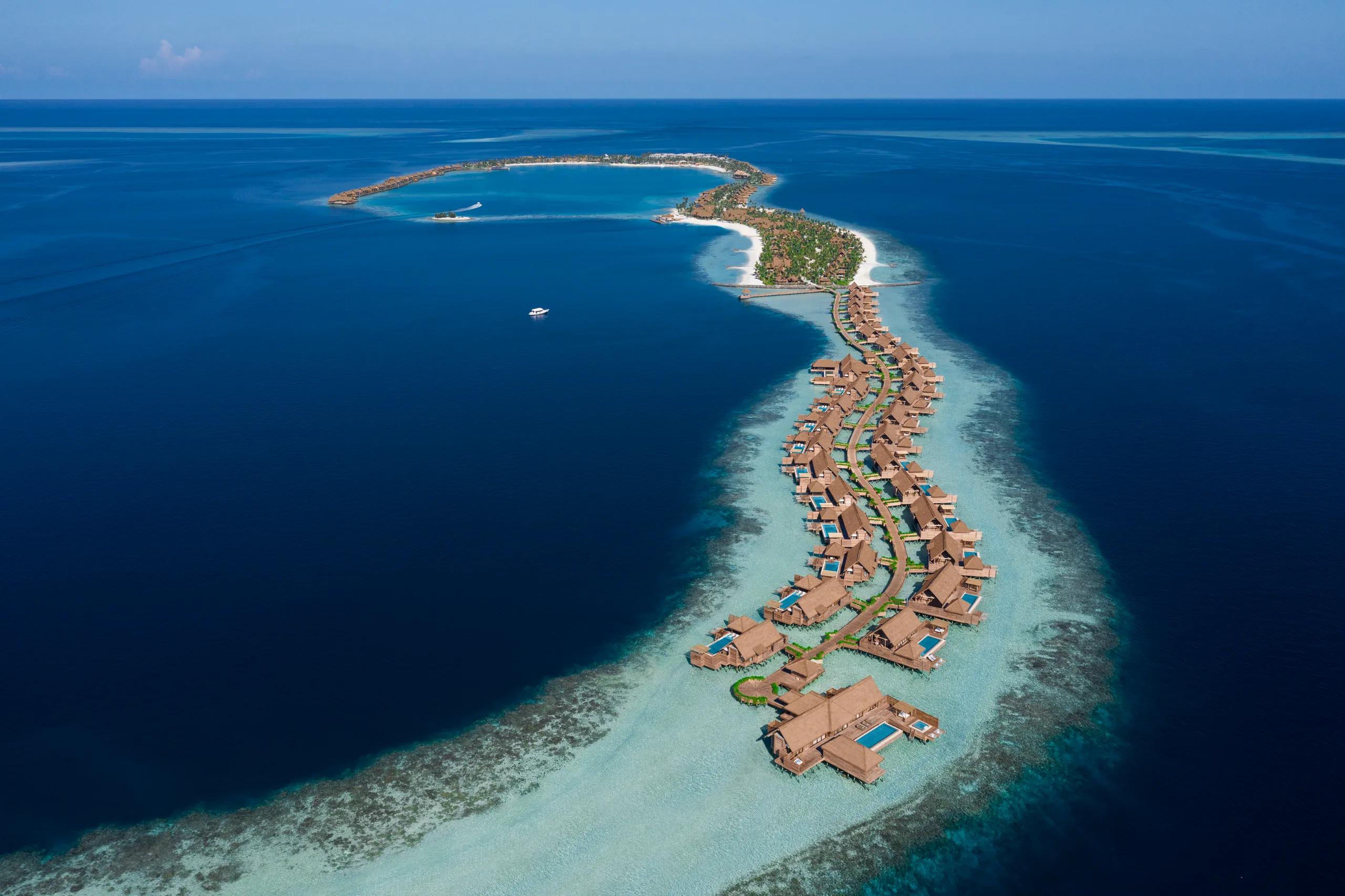 Aerial view of Waldorf Astoria Maldives Ithaafushi's three interconnected islands in South Malé Atoll