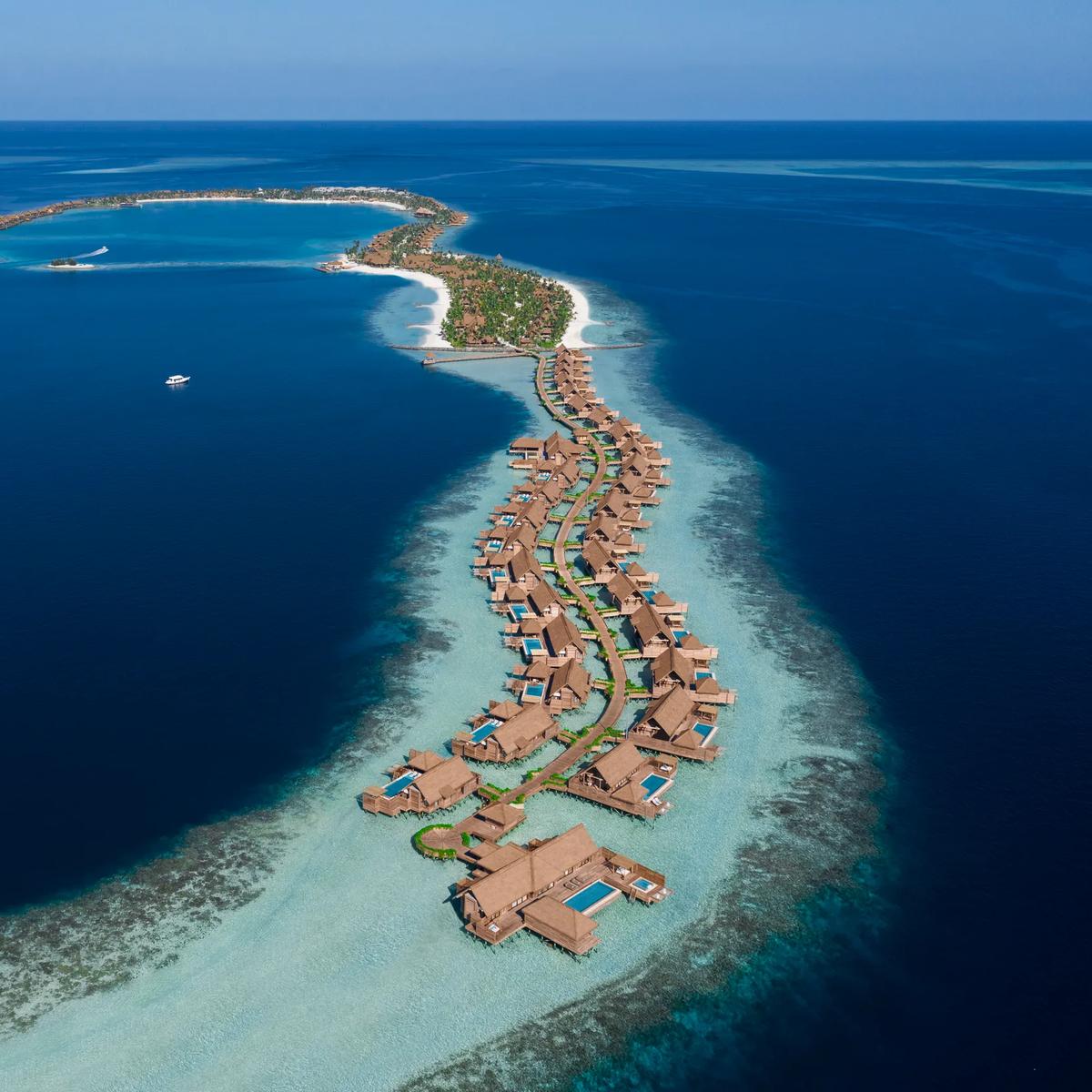 Aerial view of Waldorf Astoria Maldives Ithaafushi's three interconnected islands in South Malé Atoll