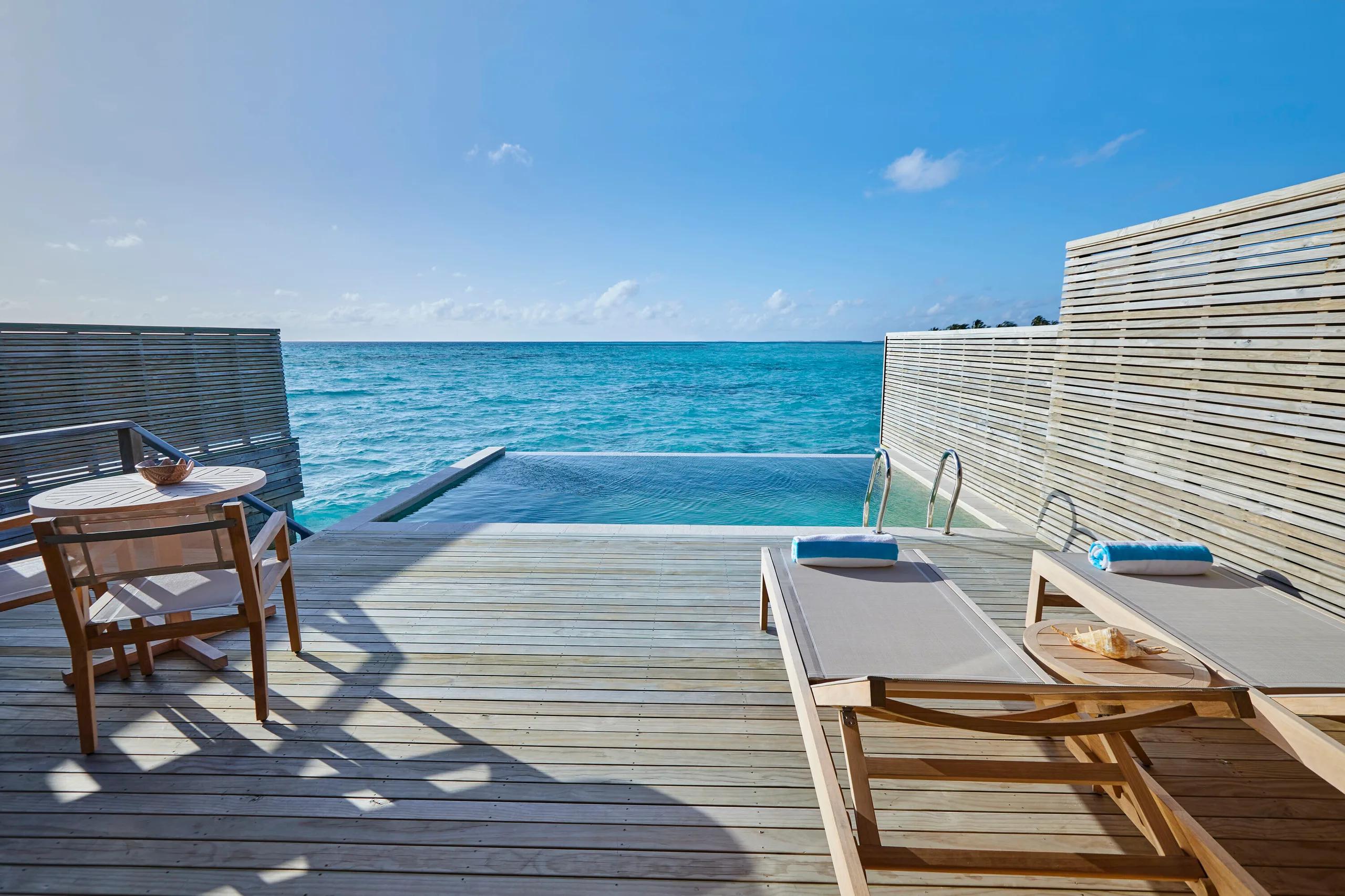 The private infinity pool and sundeck of a Water Pool Villa at Jawakara, facing straight out over the open lagoon