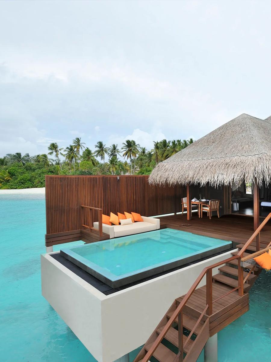 Two connected Ocean Villas on stilts over the lagoon, each with its own cantilevered plunge pool