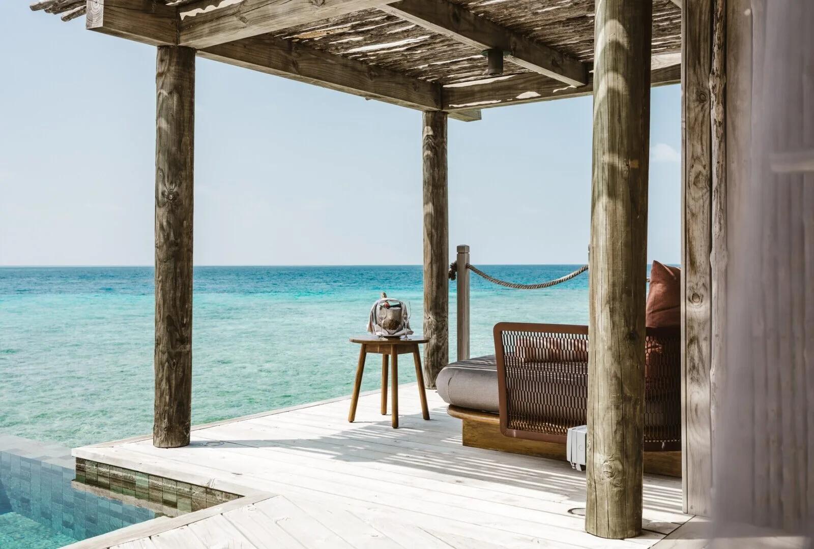 The private deck and plunge pool of an Overwater Pool Villa, open to the ocean