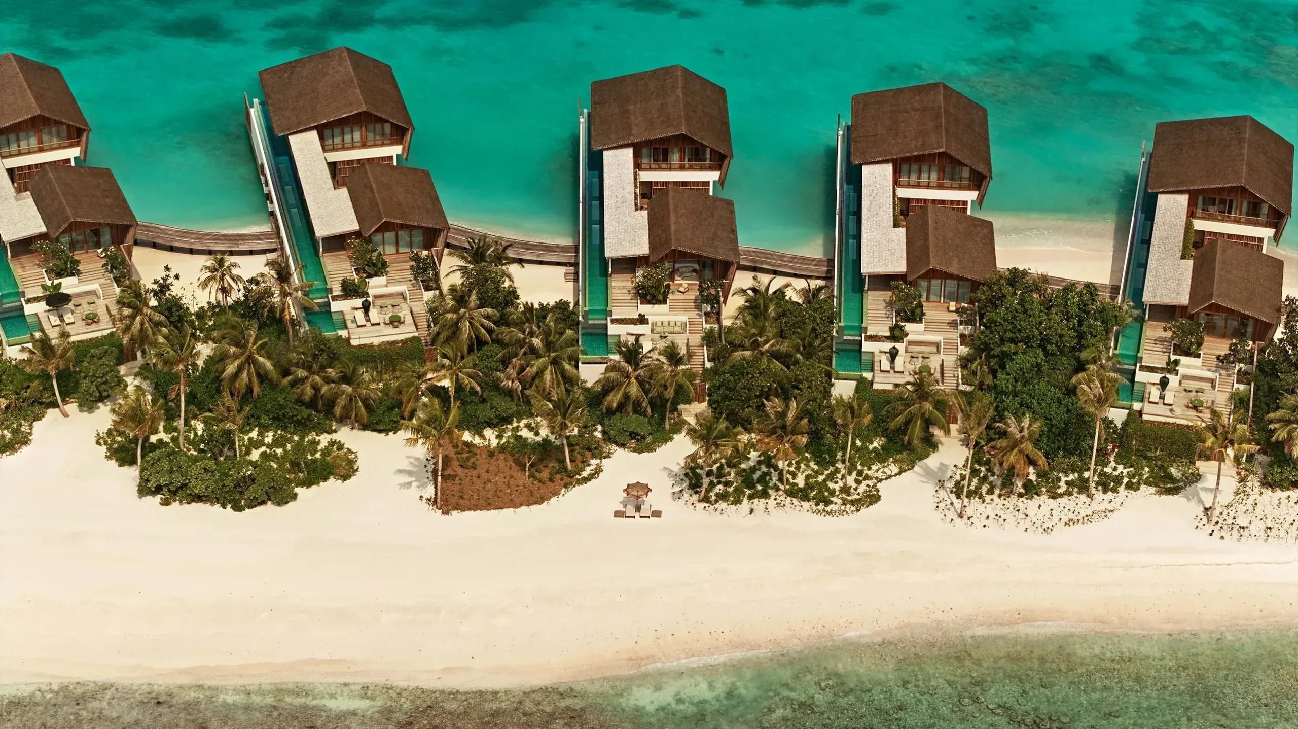 Aerial view of Somewhere's residences at .Here, tracing the shared sandbank between the two private islands