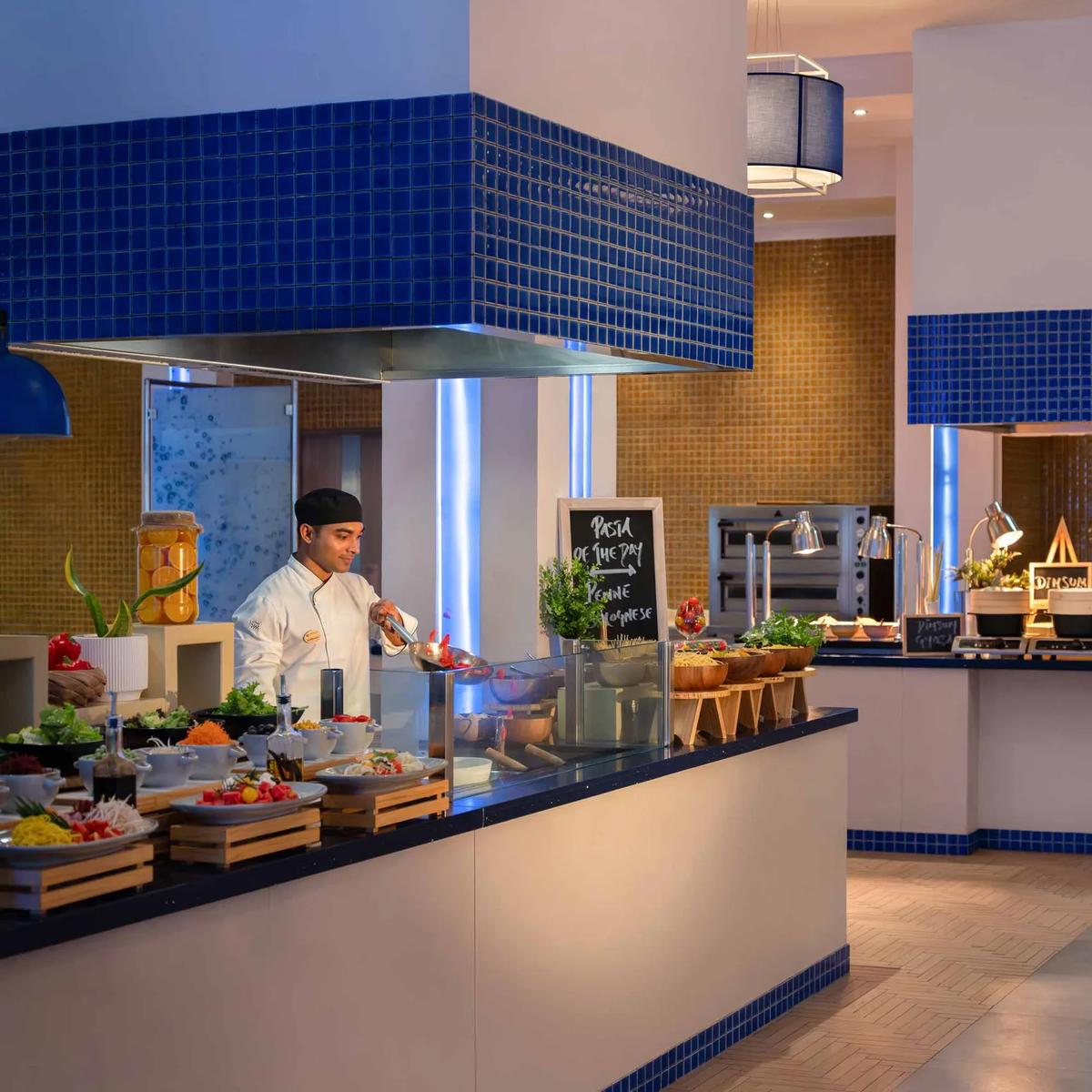 Aqua Restaurant's dining room, tables set for an international buffet service