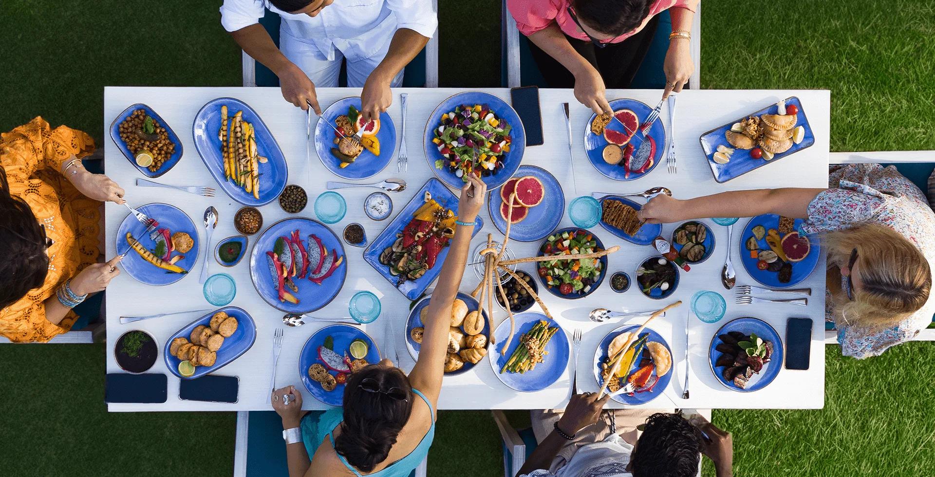 Guests dining at Social House, Ifuru Island Maldives' global-cuisine restaurant