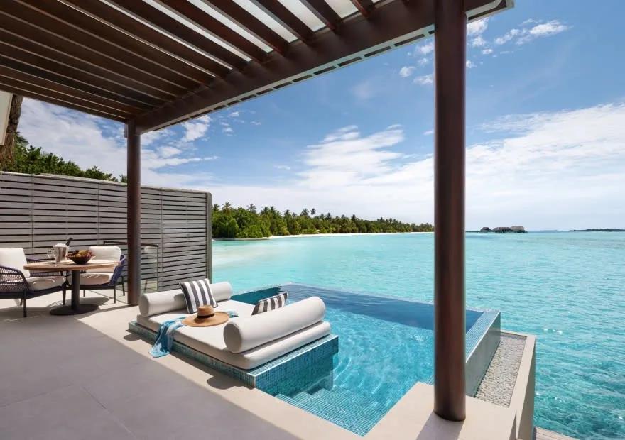 Pool deck of a Deluxe Overwater Pool Villa at Niyama, looking out over the Indian Ocean