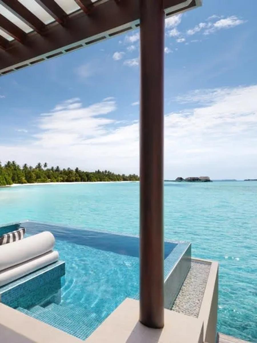 Pool deck of a Deluxe Overwater Pool Villa at Niyama, looking out over the Indian Ocean