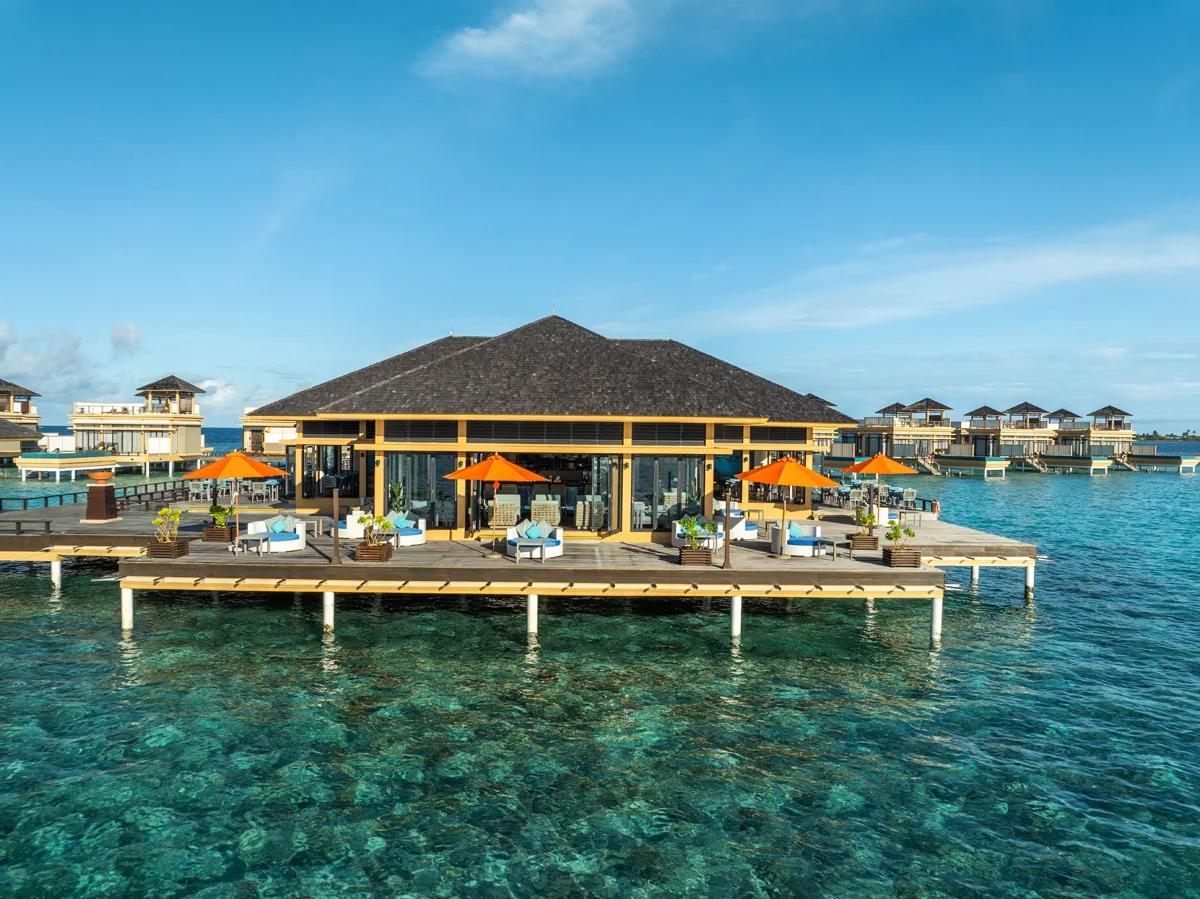 Aerial view of Azzurro Restaurant & Bar's overwater structure at Angsana Velavaru