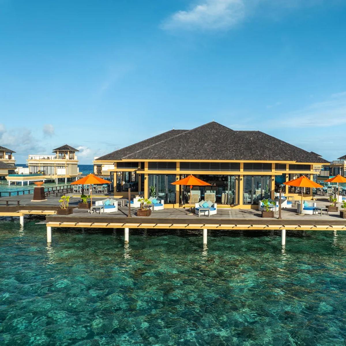 Aerial view of Azzurro Restaurant & Bar's overwater structure at Angsana Velavaru