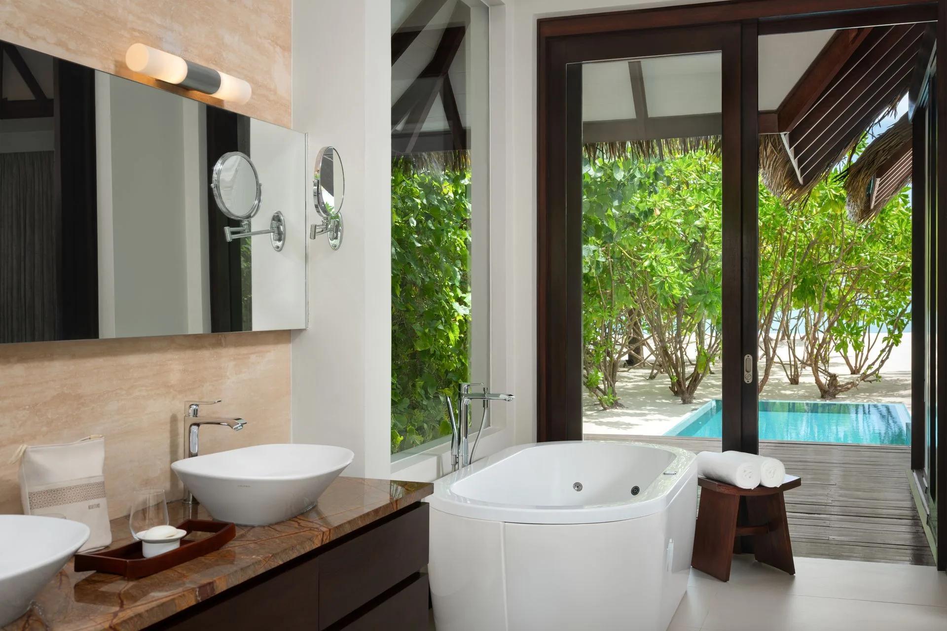 Interior of a Family Pool Beach Villa at Heritance Aarah, with the private plunge pool visible outside