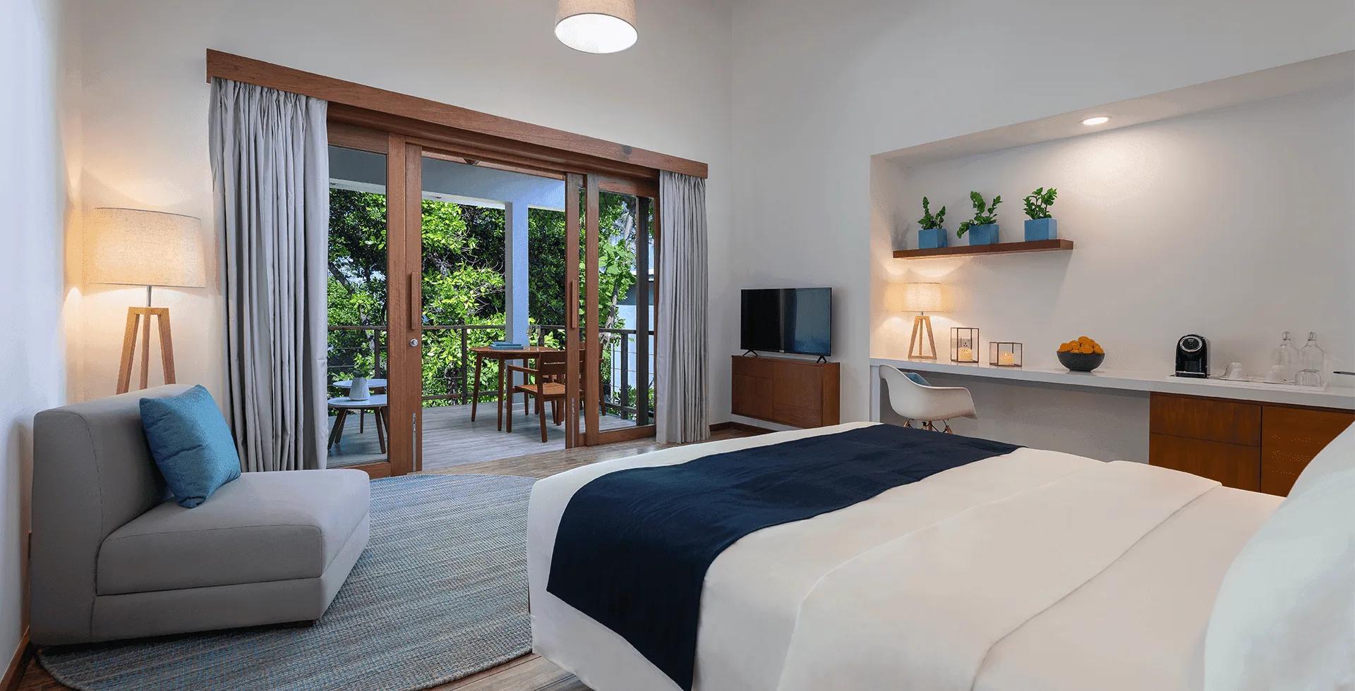 The bedroom of a Sunset Sky Suite at Ifuru Island Maldives