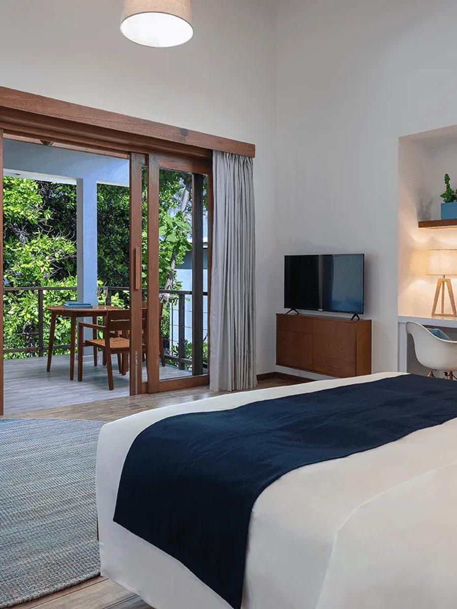 The bedroom of a Sunset Sky Suite at Ifuru Island Maldives