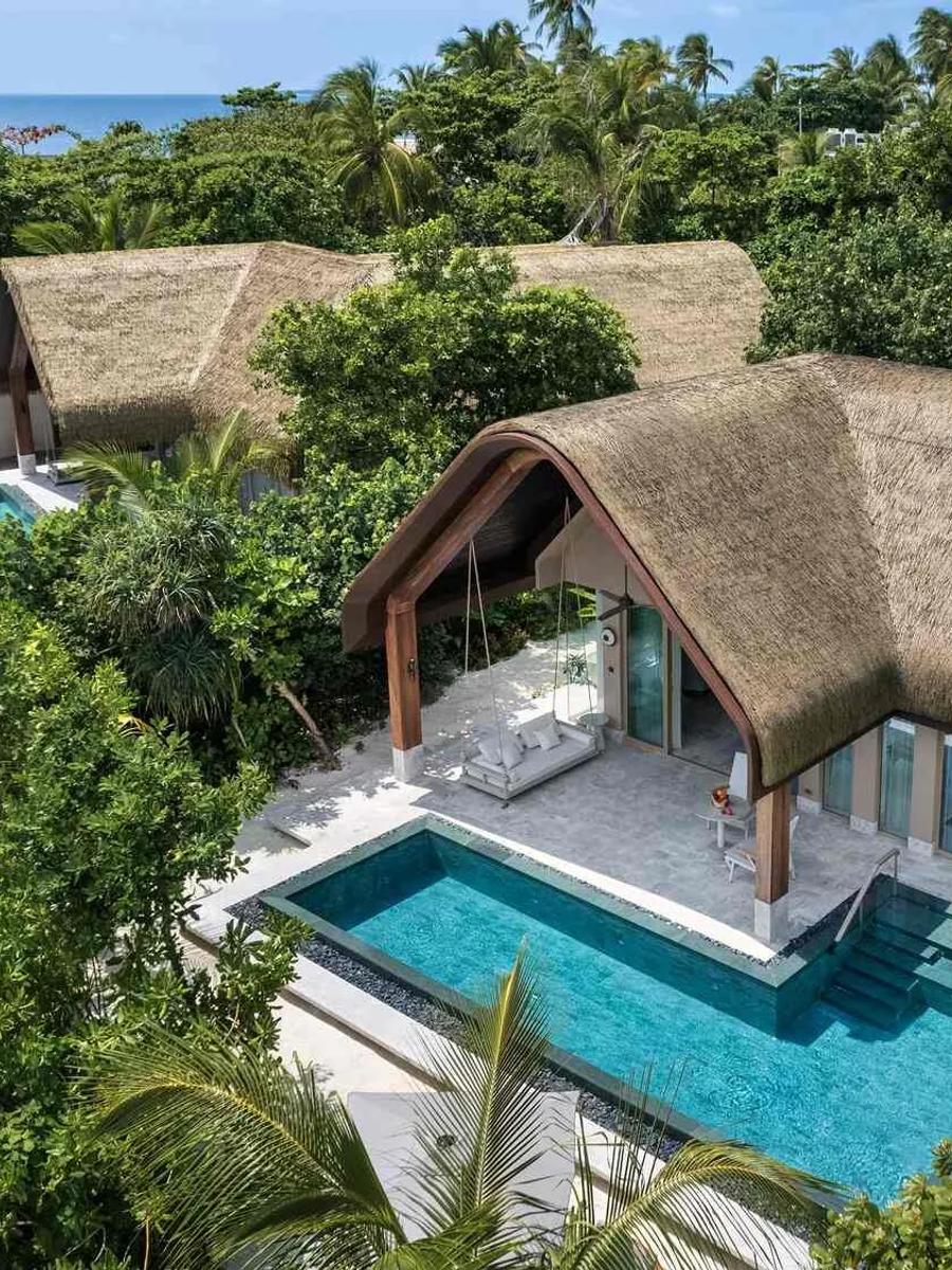 Aerial view of a Grand Beach Pool Villa at Joali Being, showing its toes-in-the-sand position on the beach