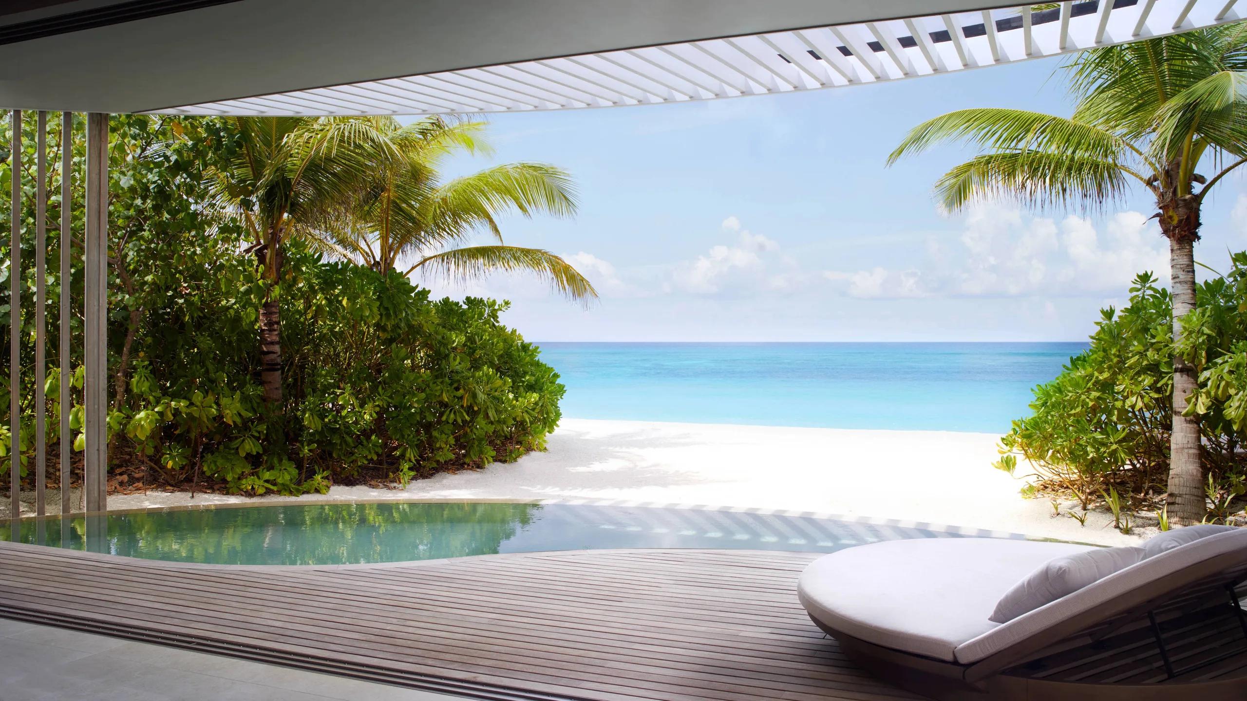 A villa's pool deck opening onto the beach — stands in for the Sunset Beach Pool Villa, which has no dedicated photography on the official site