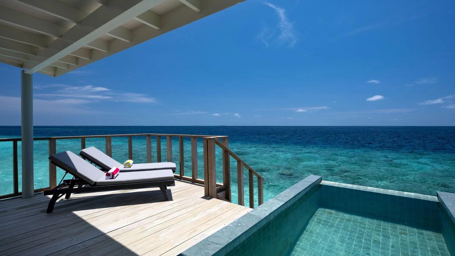 The private plunge pool and sun deck of a SunNest Water Pool Villa at OBLU SELECT Lobigili, overwater