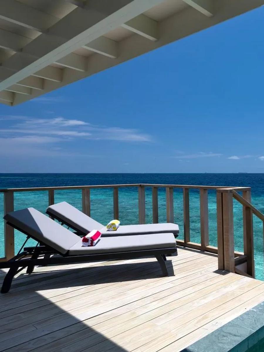 The private plunge pool and sun deck of a SunNest Water Pool Villa at OBLU SELECT Lobigili, overwater
