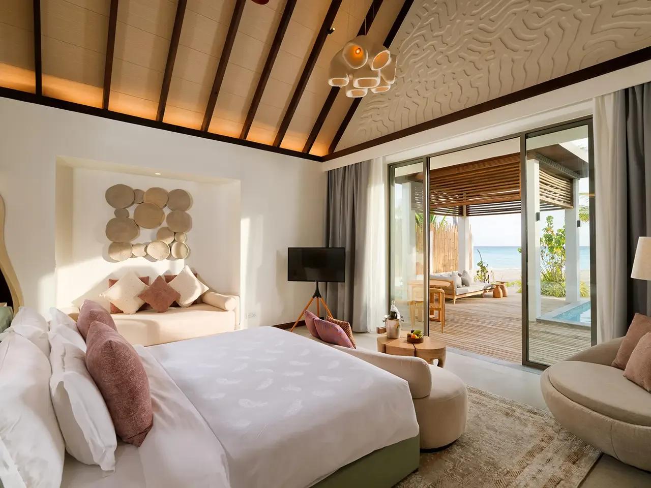 A beachfront Beach Pool Villa terrace, representative of Meyyafushi's larger Beach Suite categories