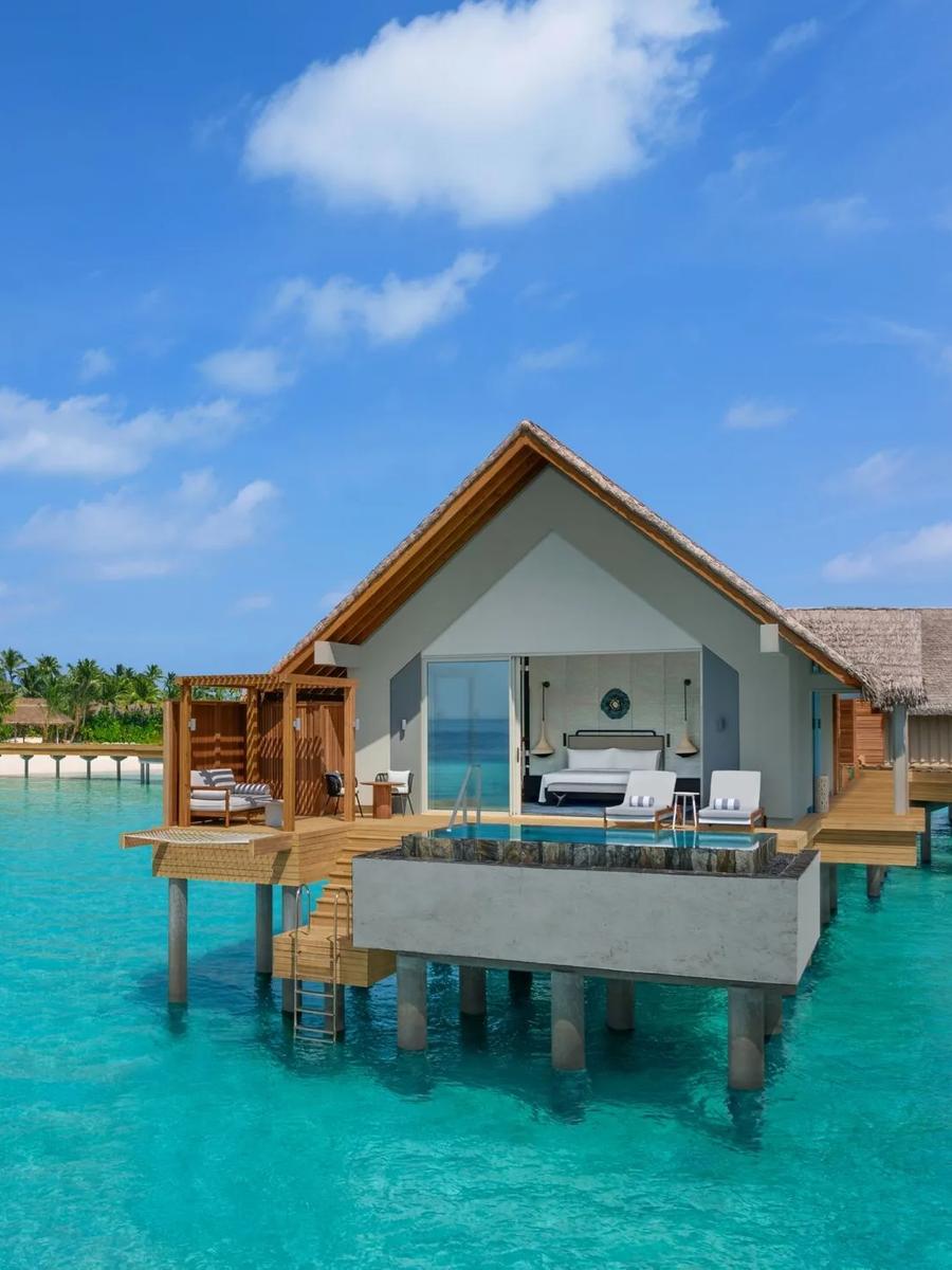 An Overwater Pool Villa's private pool and deck extending out over the lagoon