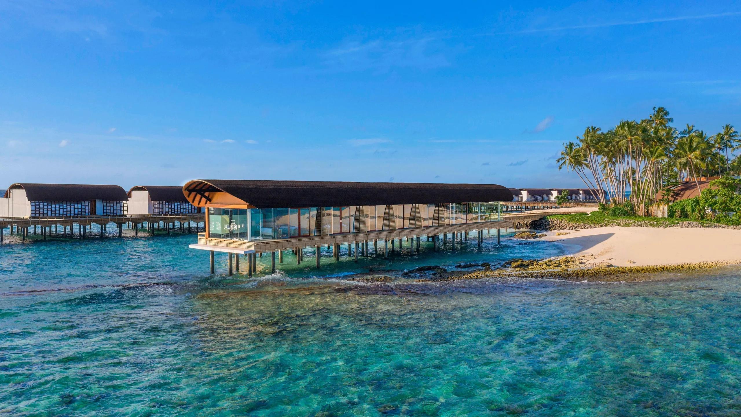 Heavenly Spa's curved overwater pavilion, reached by its own stretch of jetty