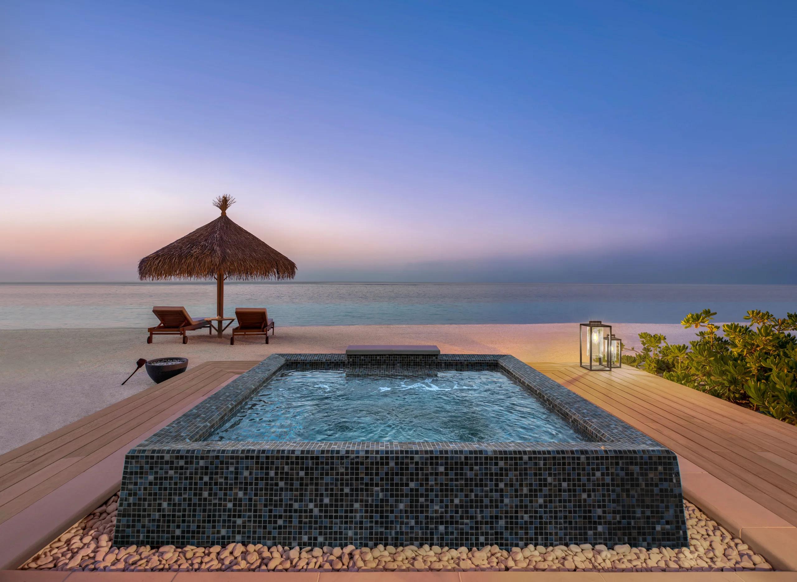 A second exterior view of the Two Bedroom Beach Villa at Waldorf Astoria Maldives Ithaafushi — the Three Bedroom Grand Beach Villa has no dedicated published photo, so this sibling beach-villa image stands in here