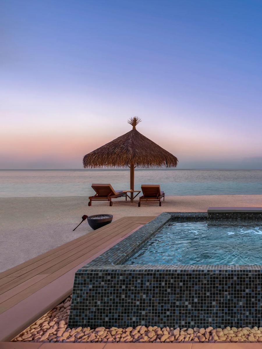 A second exterior view of the Two Bedroom Beach Villa at Waldorf Astoria Maldives Ithaafushi — the Three Bedroom Grand Beach Villa has no dedicated published photo, so this sibling beach-villa image stands in here