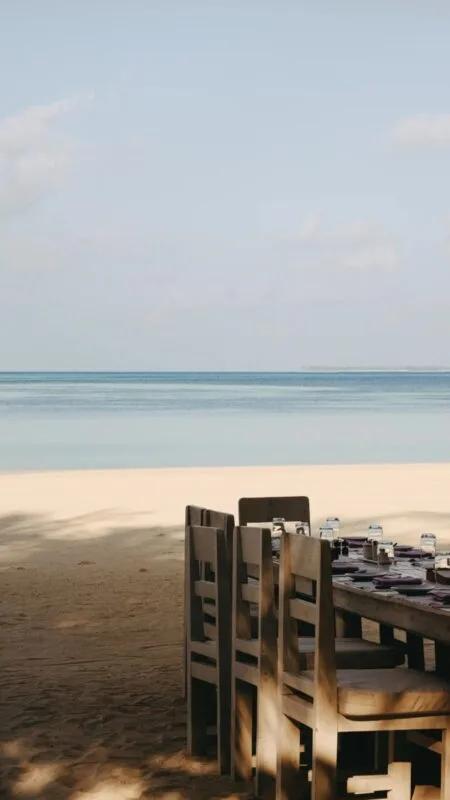 Toes-in-the-sand tables at Crab Shack, Soneva Jani's seafood restaurant at the water's edge