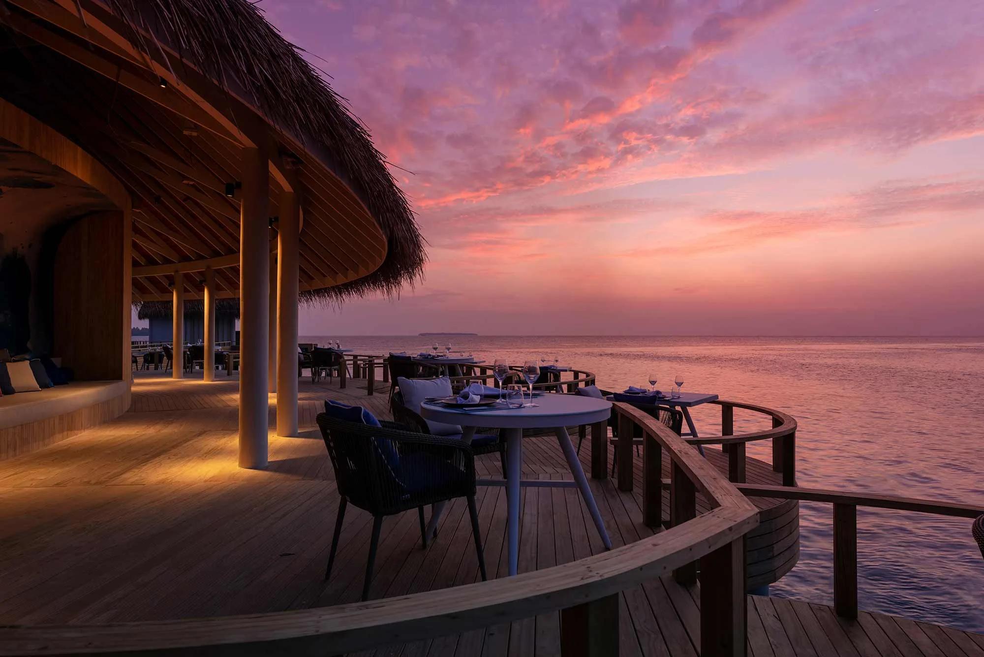 Mediterraneo Restaurant's overwater dining room at dusk