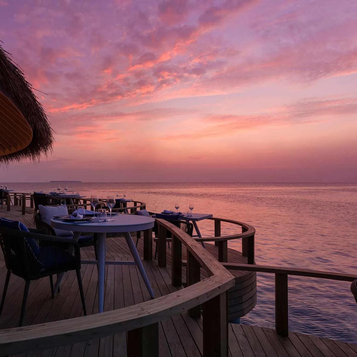 Mediterraneo Restaurant's overwater dining room at dusk