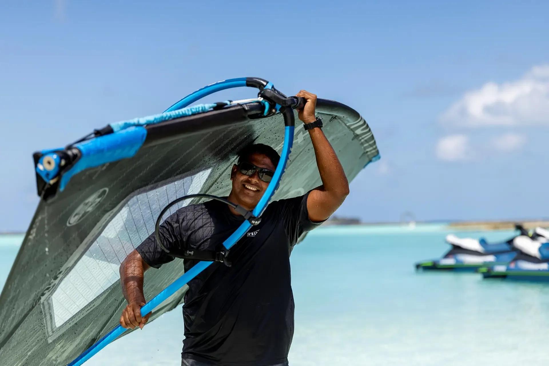 A windsurfer on the lagoon at Niva Kurumba
