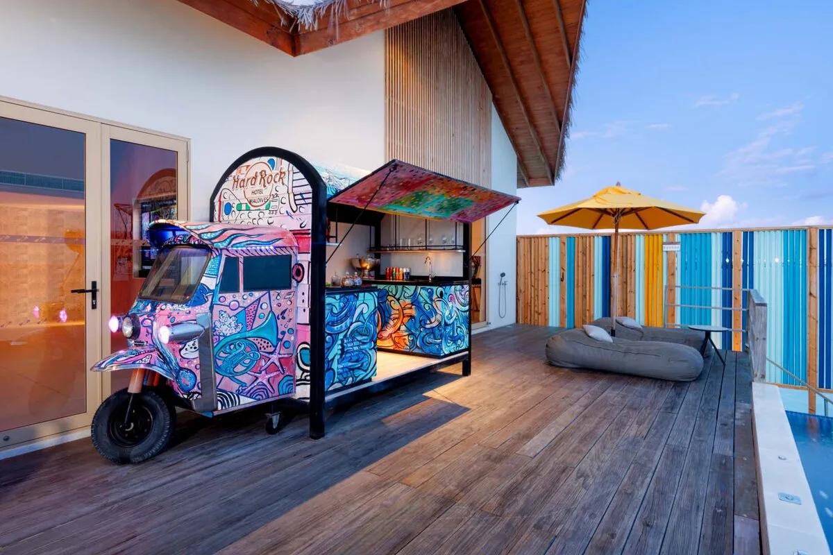 The Rock Star Villa's deck, with its signature tuk-tuk bar and a glimpse of its private pool